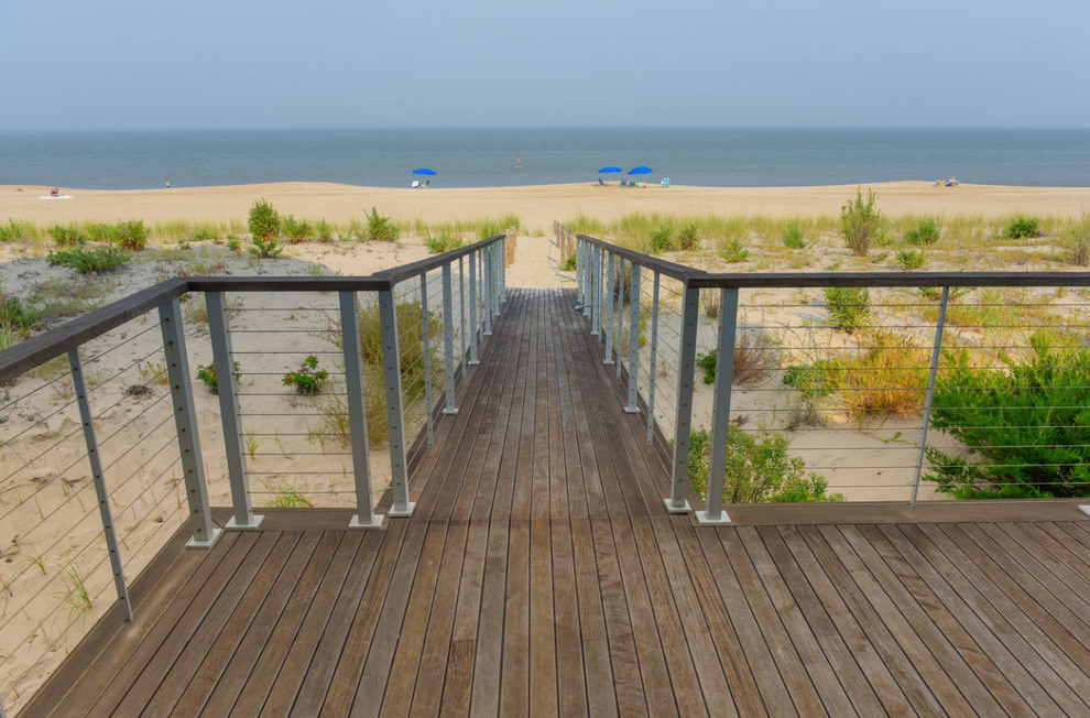 Design ideas for a large beach style backyard deck in DC Metro with with dock and no cover.