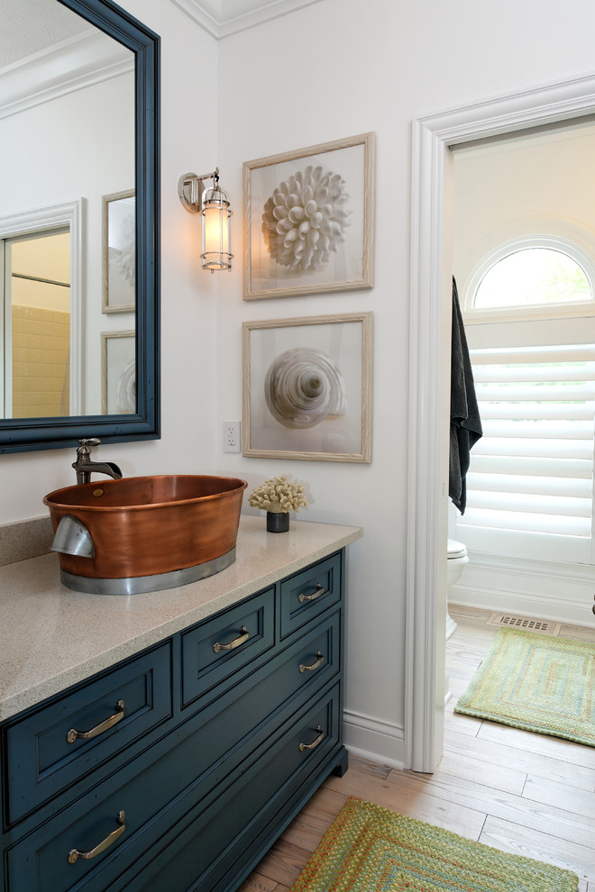 Photo of a contemporary bathroom in Indianapolis with a vessel sink and blue cabinets.