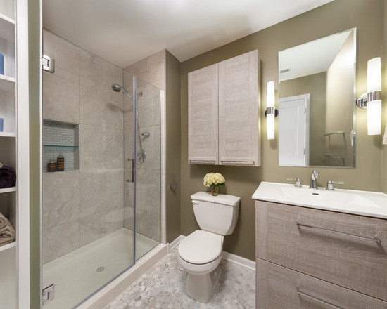 This is an example of a mid-sized transitional 3/4 bathroom in Chicago with flat-panel cabinets, medium wood cabinets, an alcove shower, a two-piece toilet, gray tile, stone slab, beige walls, mosaic tile floors, an integrated sink and marble benchtops.