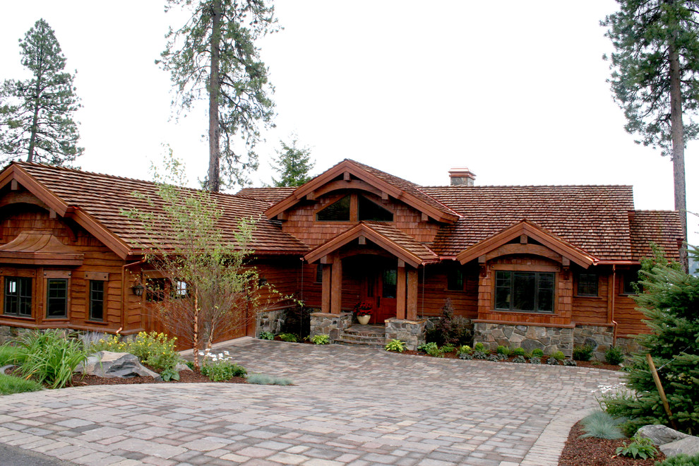 Large mountain style two-story metal gable roof photo with a shingle roof