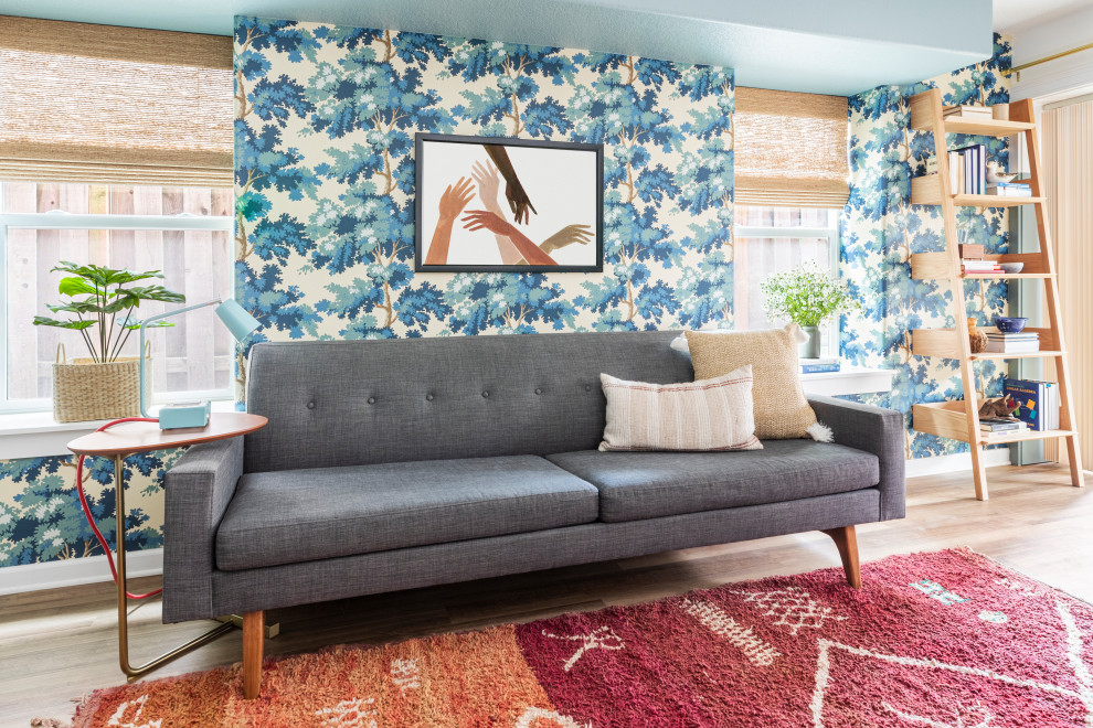 Inspiration for a large eclectic walk-out vinyl floor, brown floor and wallpaper basement game room remodel in Portland with multicolored walls, a corner fireplace and a plaster fireplace