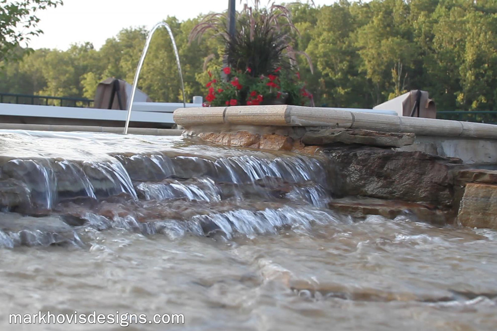 Example of a mountain style front yard wood, stone and custom-shaped natural pool fountain design