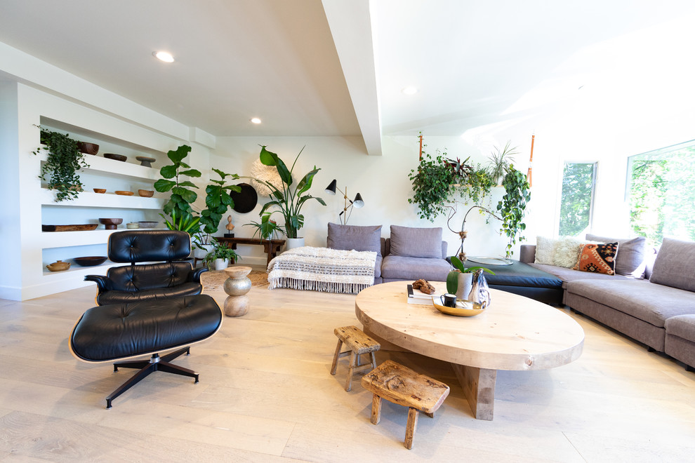 Inspiration for a huge scandinavian enclosed light wood floor and beige floor living room remodel in Calgary with white walls, no fireplace and a wall-mounted tv