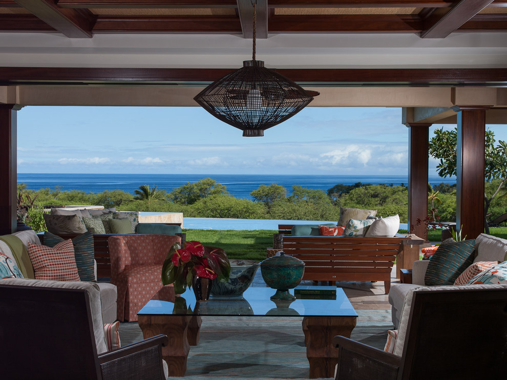 Tropical patio in Hawaii with a roof extension.