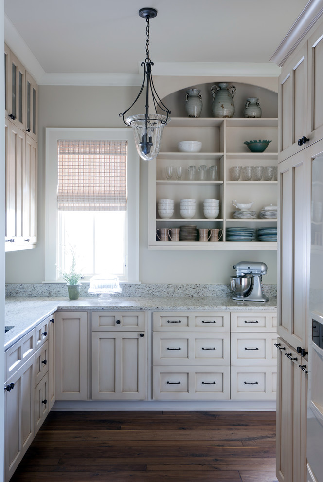 Inspiration for a traditional kitchen in Nashville with shaker cabinets, beige cabinets, granite benchtops, dark hardwood floors and an undermount sink.