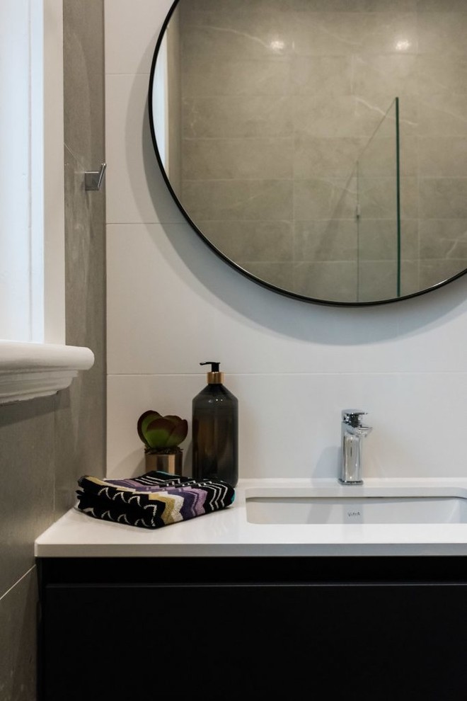 Design ideas for a mid-sized modern 3/4 bathroom in Melbourne with shaker cabinets, grey cabinets, white tile, ceramic tile, white walls, an undermount sink, engineered quartz benchtops, white benchtops and a hinged shower door.