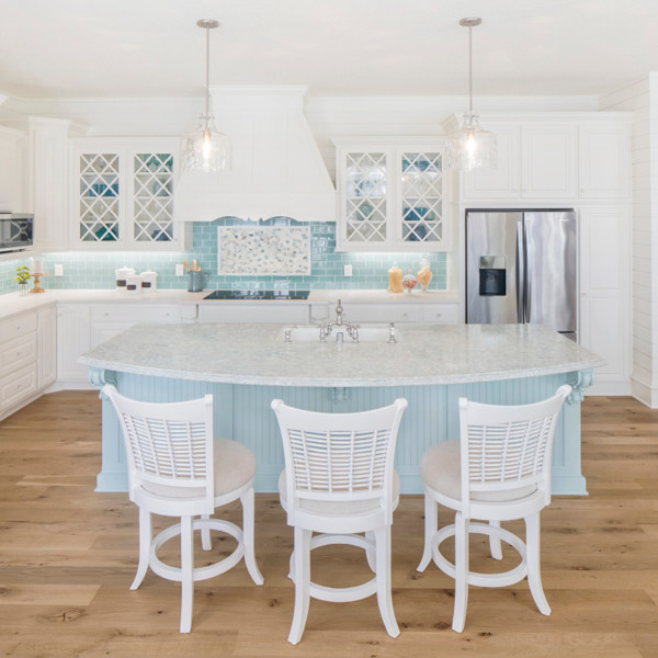 Photo of a beach style kitchen in Minneapolis with quartz benchtops and with island.