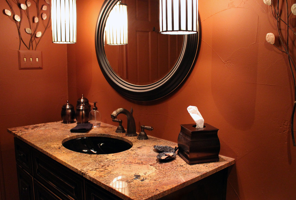 Alcove bathtub - mid-sized transitional 3/4 beige tile and porcelain tile alcove bathtub idea in Austin with raised-panel cabinets, black cabinets, granite countertops, an undermount sink and brown walls