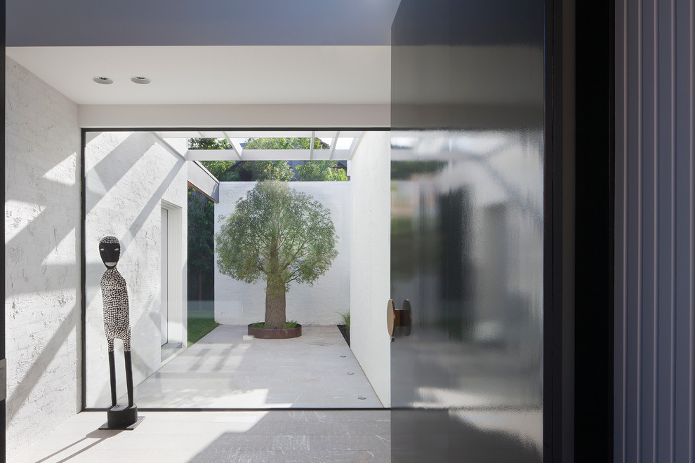 This is an example of a contemporary entryway in Melbourne.