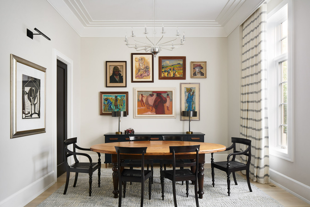 Inspiration for a transitional light wood floor, beige floor and tray ceiling dining room remodel in Chicago with beige walls