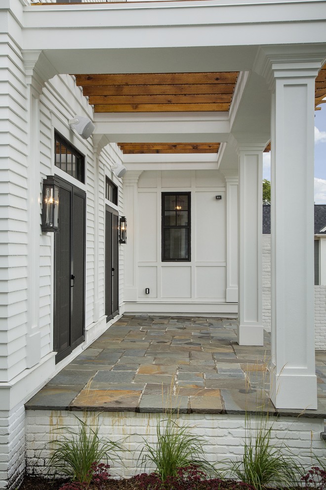 Inspiration for a traditional two-storey white exterior in Minneapolis.