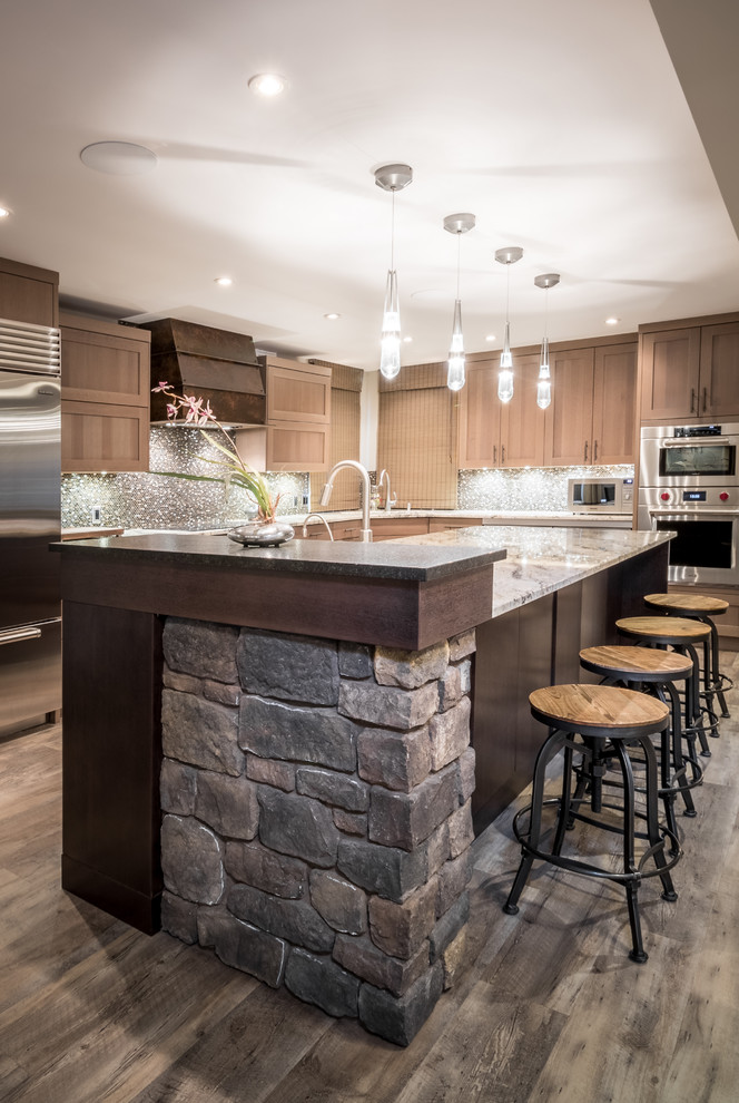 Inspiration for a transitional l-shaped vinyl floor eat-in kitchen remodel with an undermount sink, shaker cabinets, light wood cabinets, granite countertops, brown backsplash, mosaic tile backsplash, stainless steel appliances and an island