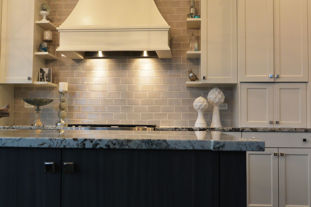 Example of a transitional l-shaped eat-in kitchen design in Chicago with a single-bowl sink, flat-panel cabinets, gray cabinets, quartzite countertops, gray backsplash, subway tile backsplash and stainless steel appliances