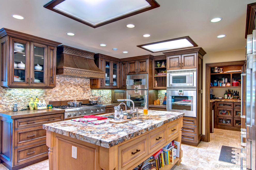 Design ideas for an arts and crafts separate kitchen in Orange County with an undermount sink and medium wood cabinets.