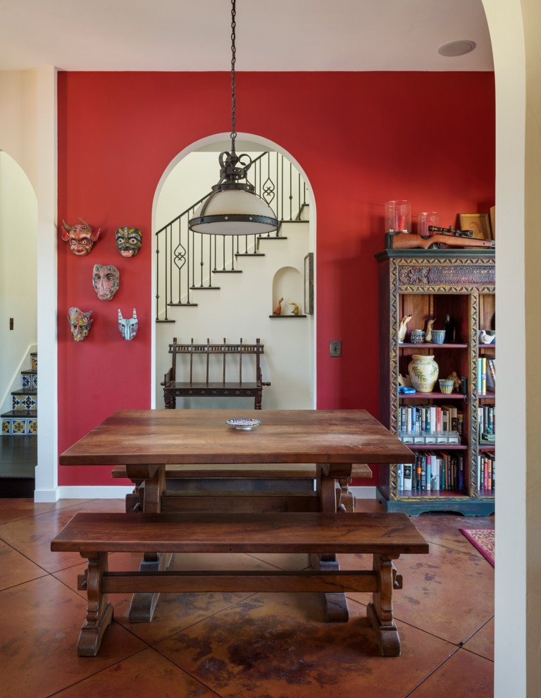This is an example of a mediterranean dining room in San Francisco with red walls.