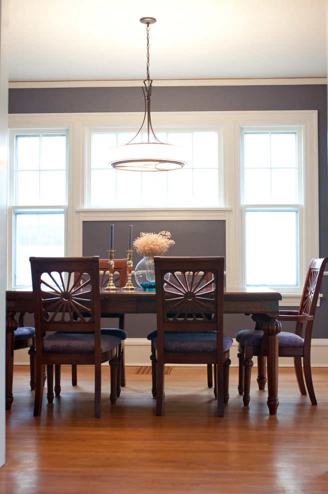 Inspiration for a mid-sized traditional separate dining room in Other with purple walls and medium hardwood floors.