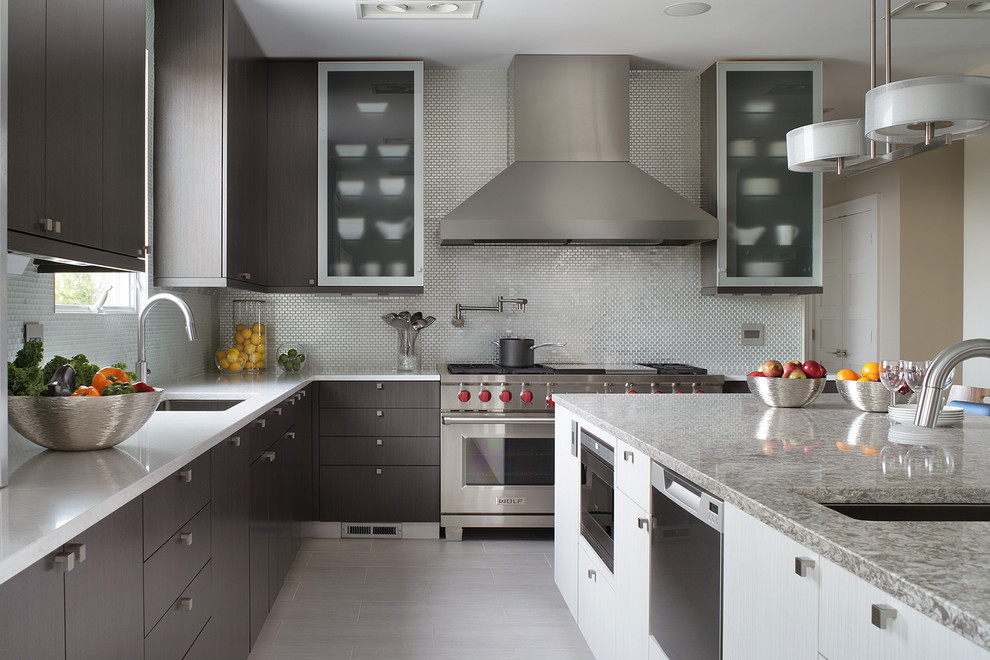 Photo of a large contemporary l-shaped kitchen in Other with flat-panel cabinets, an undermount sink, quartz benchtops, metallic splashback, stainless steel appliances, ceramic floors, metal splashback and dark wood cabinets.