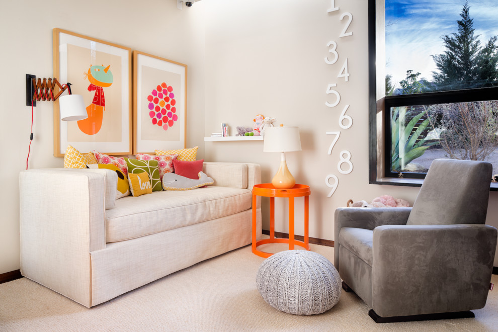 This is an example of a large modern gender-neutral nursery in Austin with dark hardwood floors.