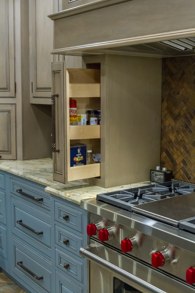 Inspiration for a rustic kitchen remodel with stainless steel appliances and an island