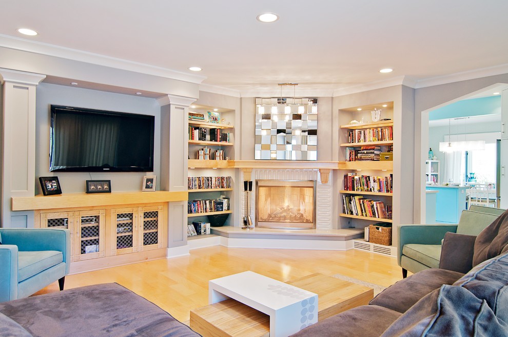 Photo of a contemporary family room in Chicago with a corner fireplace.