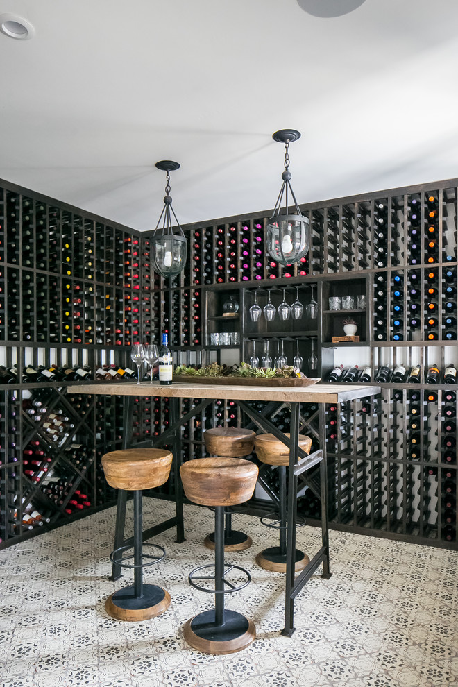 Cottage ceramic tile and multicolored floor wine cellar photo in San Diego with storage racks