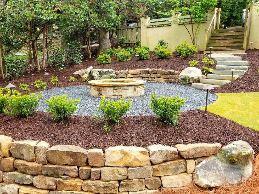 Mid-sized traditional backyard patio in Atlanta with a fire feature and gravel.