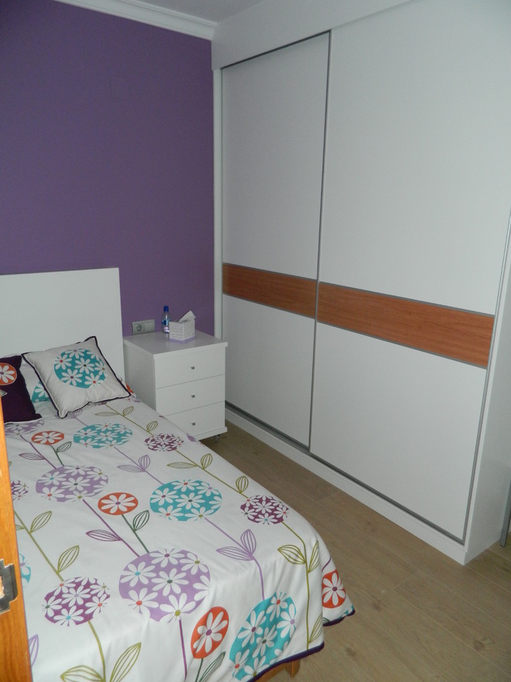 Design ideas for a small transitional kids' room for girls in Other with purple walls and medium hardwood floors.