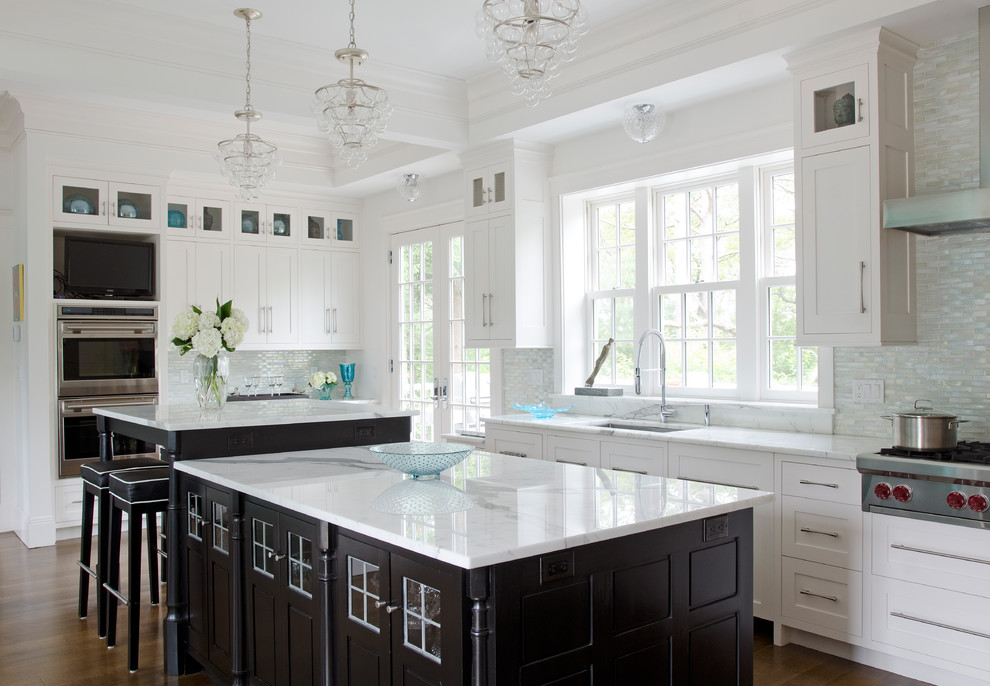 Inspiration for a transitional kitchen in Manchester with an undermount sink, shaker cabinets, white cabinets, grey splashback, stainless steel appliances, dark hardwood floors, with island, brown floor and grey benchtop.