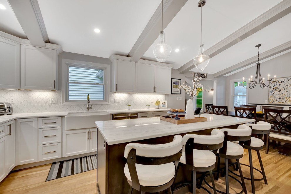 Transitional light wood floor eat-in kitchen photo in Boston with an island