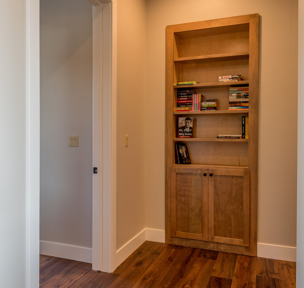 Inspiration for a mid-sized rustic dark wood floor and brown floor hallway remodel with beige walls
