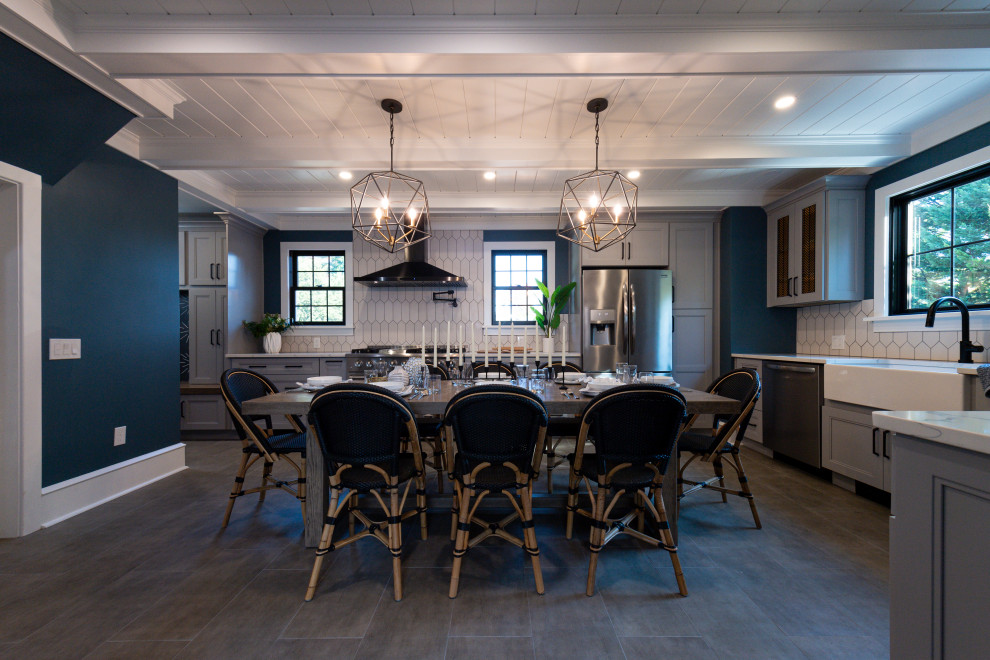 Large transitional l-shaped gray floor and exposed beam eat-in kitchen photo in Philadelphia with a farmhouse sink, white cabinets, white backsplash, white countertops, shaker cabinets, quartz countertops and ceramic backsplash