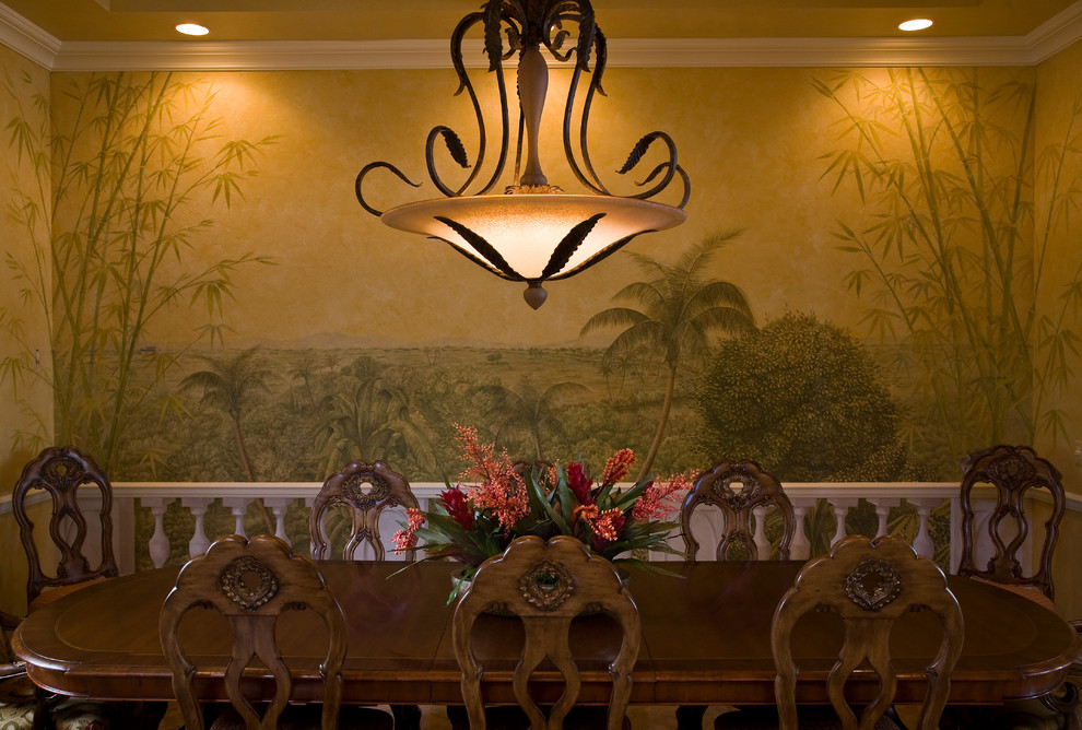 This is an example of a tropical dining room in Miami with multi-coloured walls.