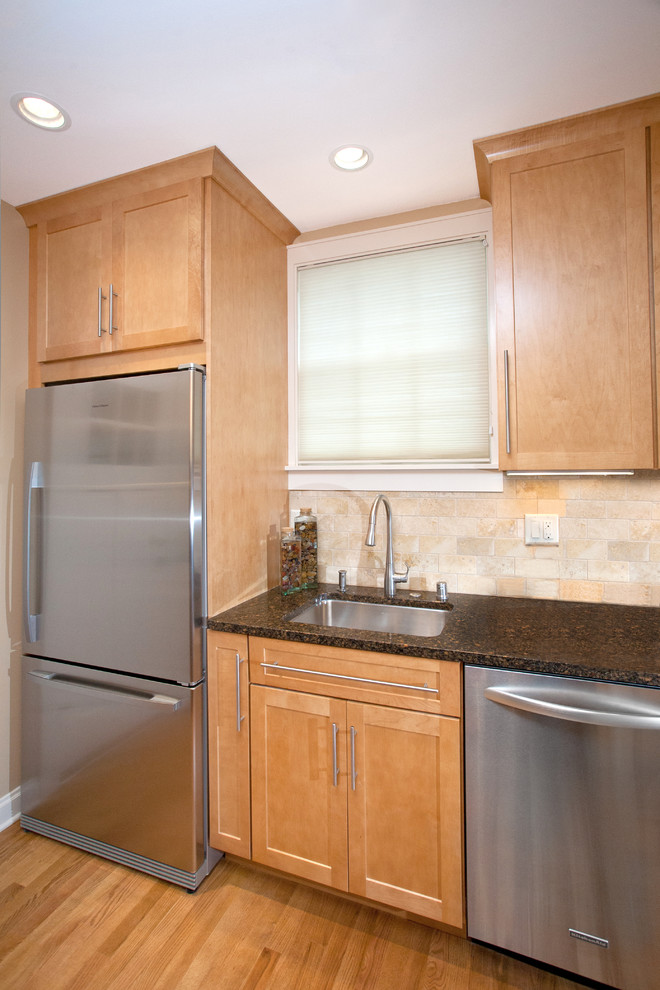 Small transitional galley medium tone wood floor eat-in kitchen photo with an undermount sink, recessed-panel cabinets, light wood cabinets, quartz countertops, beige backsplash, stone tile backsplash, white appliances, beige walls and no island