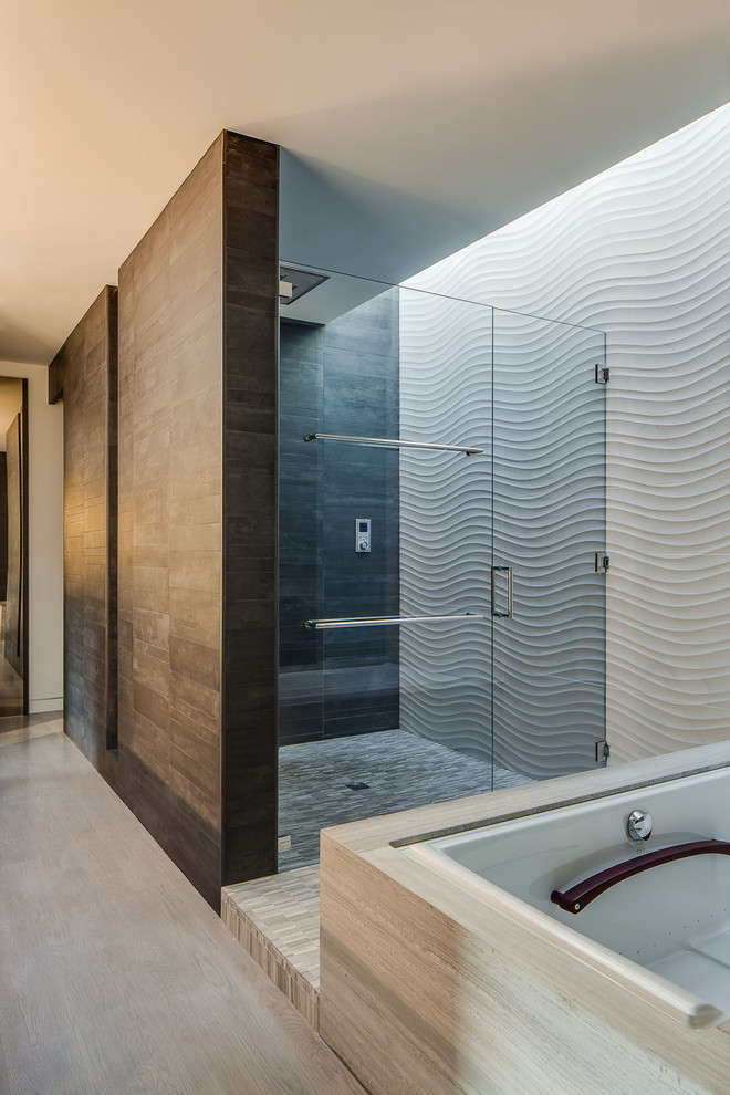 This is an example of a mid-sized modern master bathroom in San Francisco with flat-panel cabinets, dark wood cabinets, an undermount tub, an alcove shower, white tile, white walls, medium hardwood floors, an undermount sink, solid surface benchtops, brown floor, a hinged shower door and a wall-mount toilet.