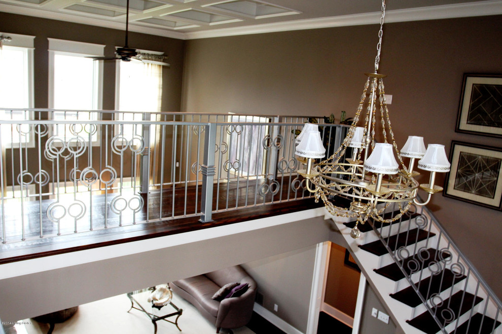 Design ideas for a modern wood straight staircase in Louisville with metal risers.