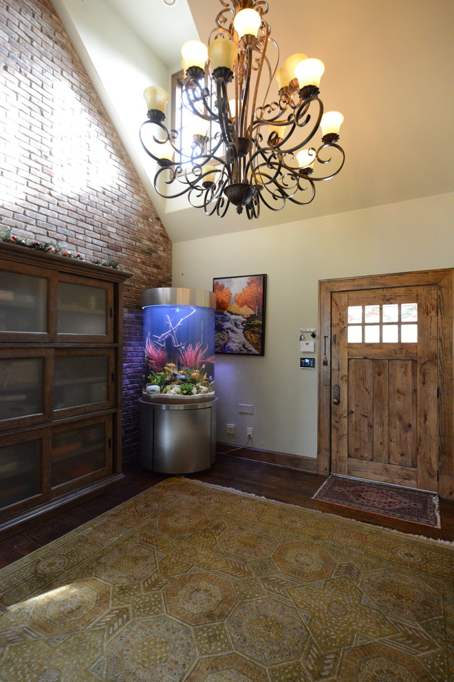 Large eclectic foyer in Dallas with beige walls, dark hardwood floors, a single front door, a dark wood front door and brown floor.