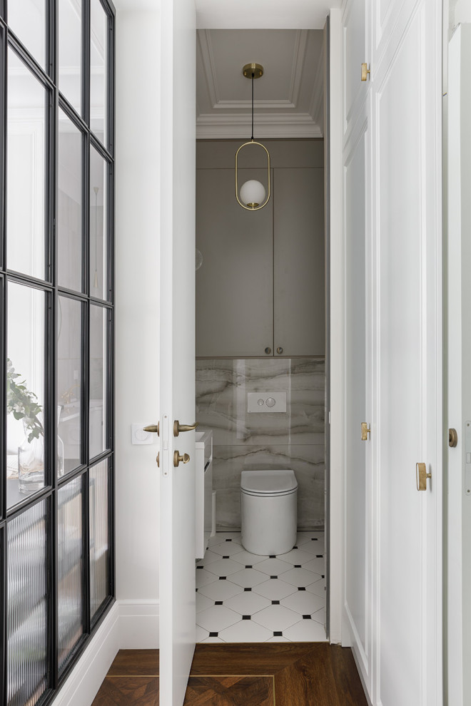 This is an example of a mid-sized scandinavian powder room in Saint Petersburg with flat-panel cabinets, grey cabinets, a wall-mount toilet, gray tile, porcelain tile, grey walls, ceramic floors, a console sink, solid surface benchtops, white floor, white benchtops and a floating vanity.
