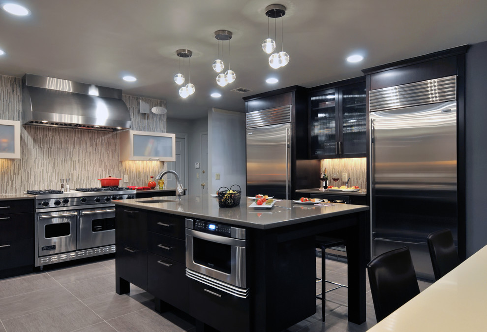 Contemporary kitchen in New York with stainless steel appliances.