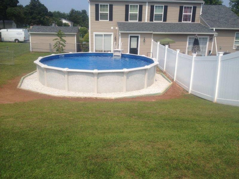 Design ideas for a mid-sized traditional backyard aboveground pool in Baltimore.