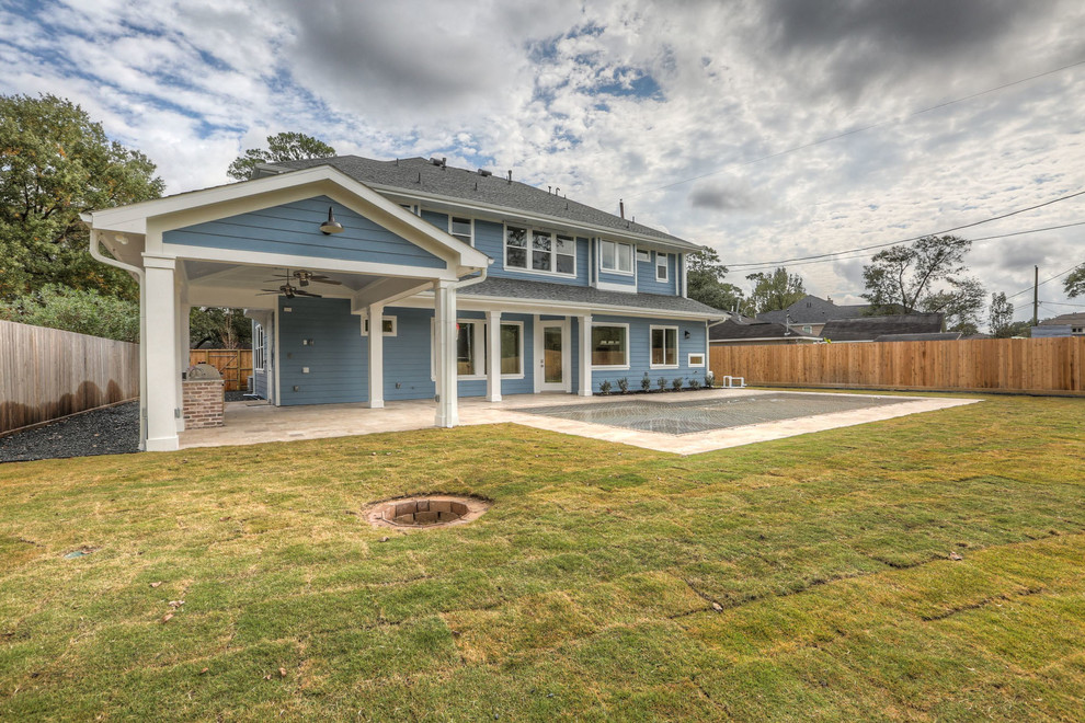 Large transitional blue two-story concrete fiberboard gable roof idea in Orlando with a shingle roof