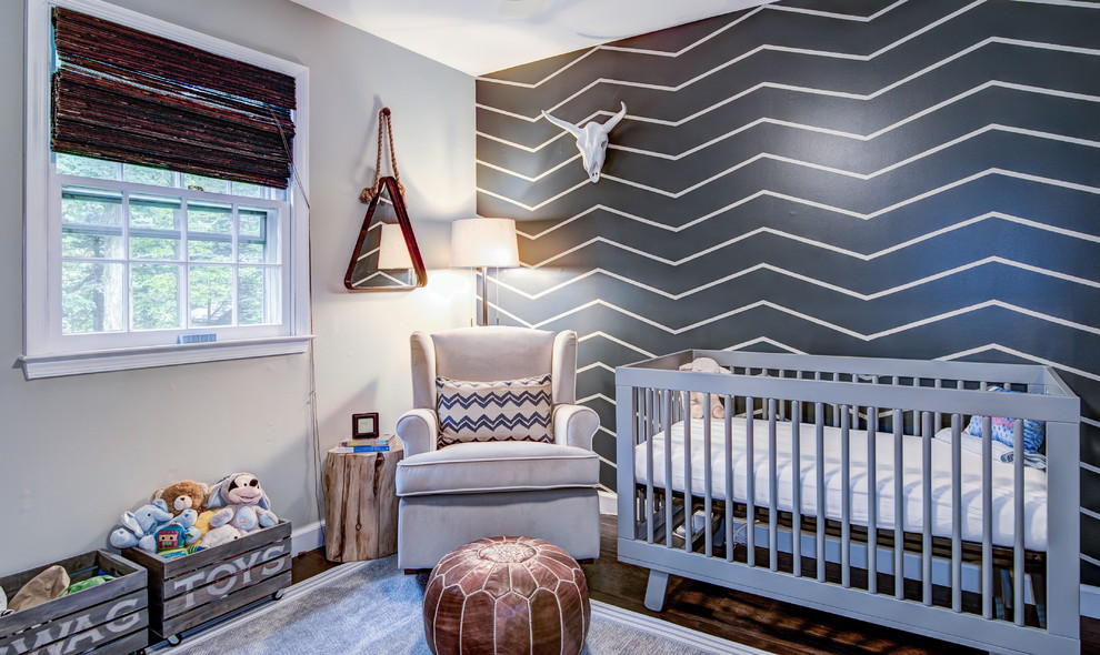 Design ideas for a transitional nursery for boys in Philadelphia with grey walls and dark hardwood floors.