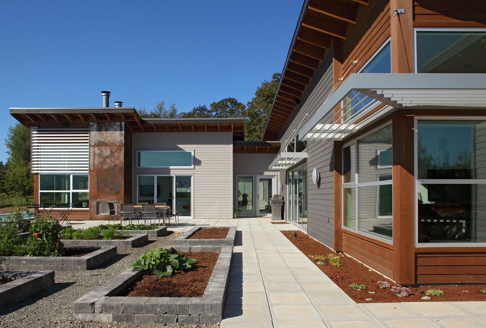 Inspiration for an industrial exterior in Portland with metal siding.