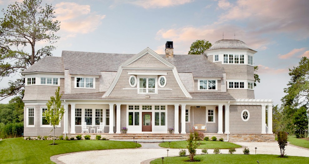 Beach style two-storey grey exterior in Boston with wood siding.
