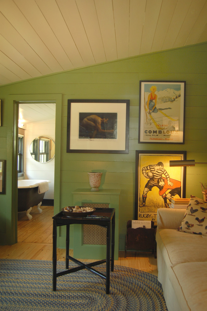 Photo of a traditional home office in Austin with green walls and beige floor.