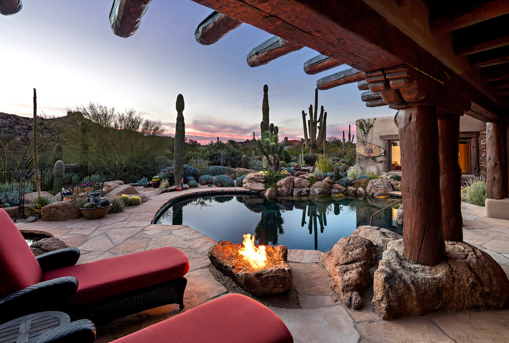 Photo of a backyard custom-shaped lap pool in Phoenix.