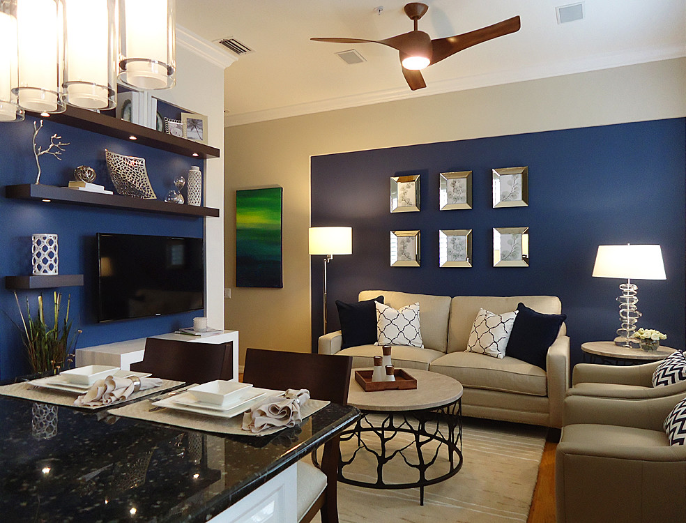 Minimalist enclosed light wood floor family room photo in Miami with blue walls