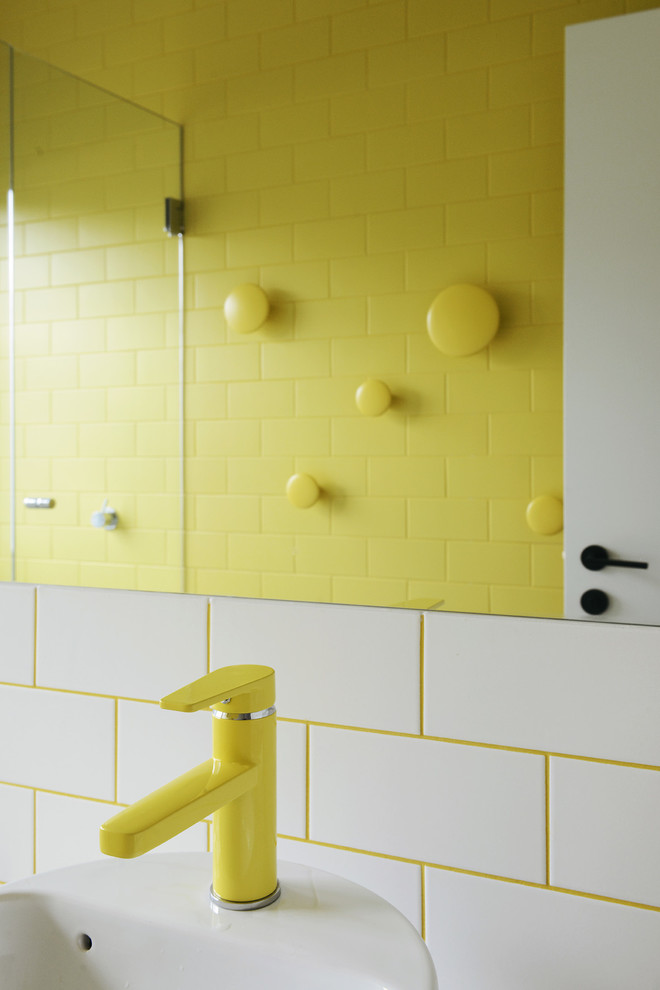 Inspiration for a bathroom in Melbourne with a vessel sink, yellow tile and ceramic tile.