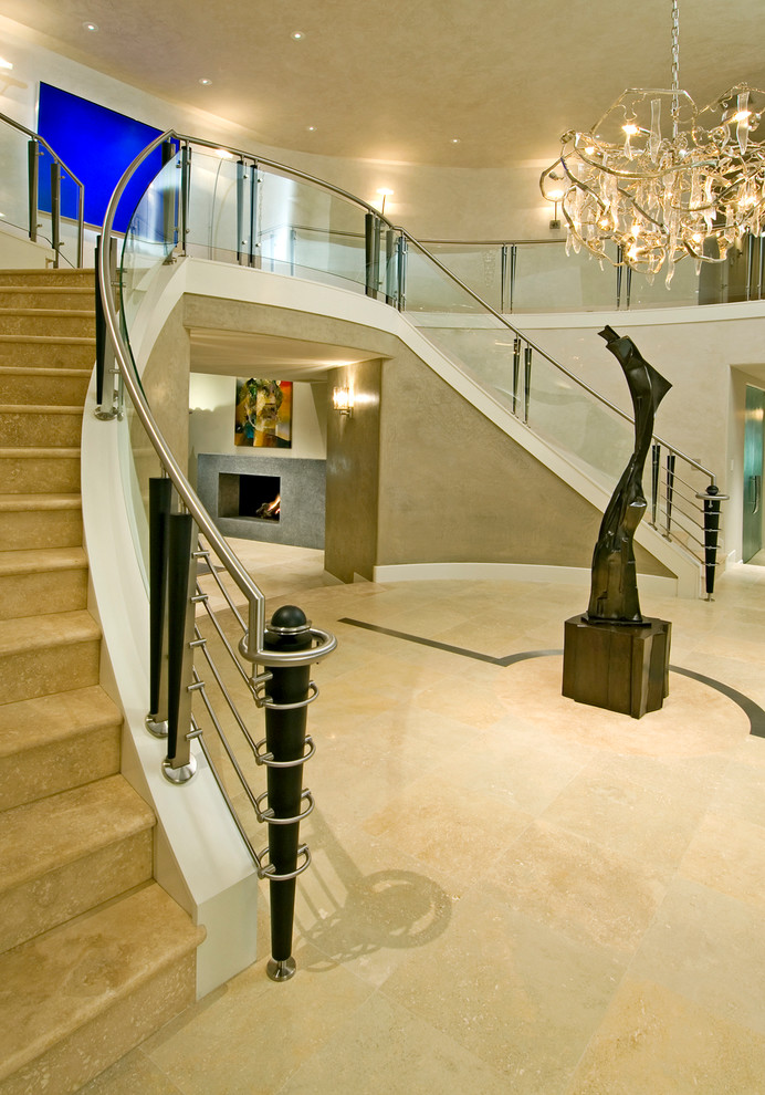This is an example of an expansive contemporary foyer in San Francisco with beige walls and limestone floors.