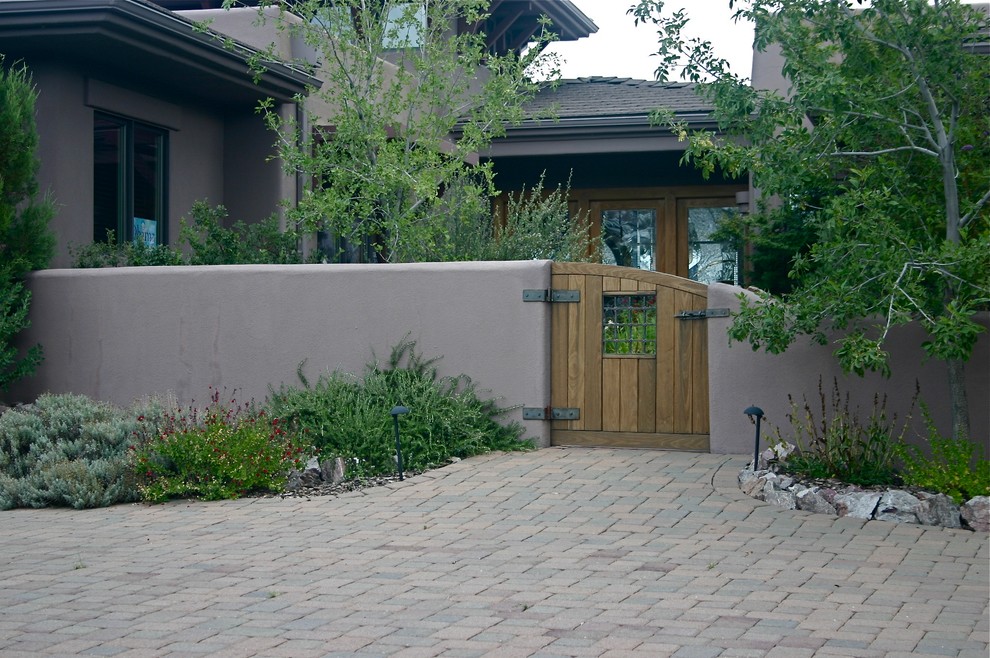 Inspiration for a large front door remodel in Phoenix with a light wood front door