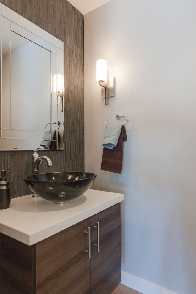 Photo of a small midcentury 3/4 bathroom in Phoenix with flat-panel cabinets, brown cabinets, gray tile, slate, grey walls, porcelain floors, a vessel sink, solid surface benchtops, brown floor, white benchtops, a single vanity and a floating vanity.